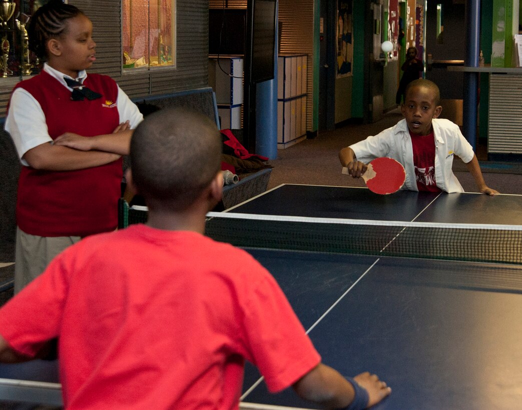 Team Andrews children play table tennis at the Joint Base Andrews Youth Center on March 19, 2013.  The youth center hosted an open house to celebrate the completion of renovations made to the gym. (U.S. Air Force photo/Staff Sgt. Torey Griffith)