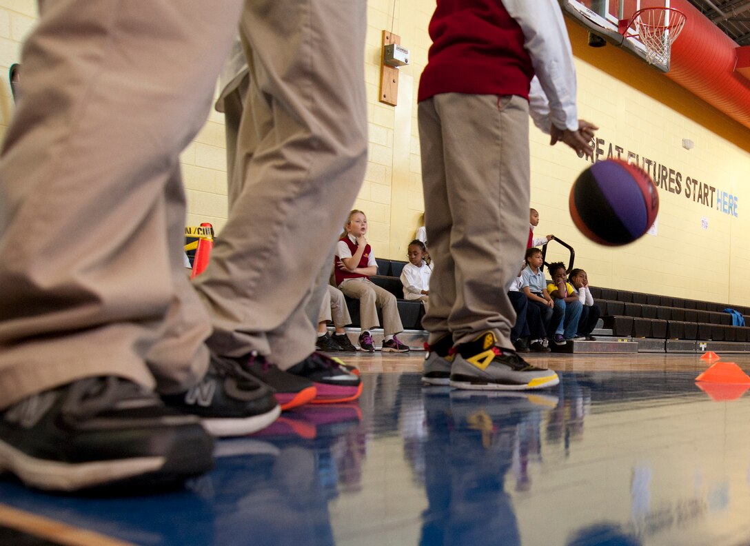 Children at the Joint Base Andrews Youth Center prepare to compete in an obstacle course during an open house held to celebrate the completion of a remodel of the gym March 19, 2013. (U.S. Air Force photo/Staff Sgt. Torey Griffith)