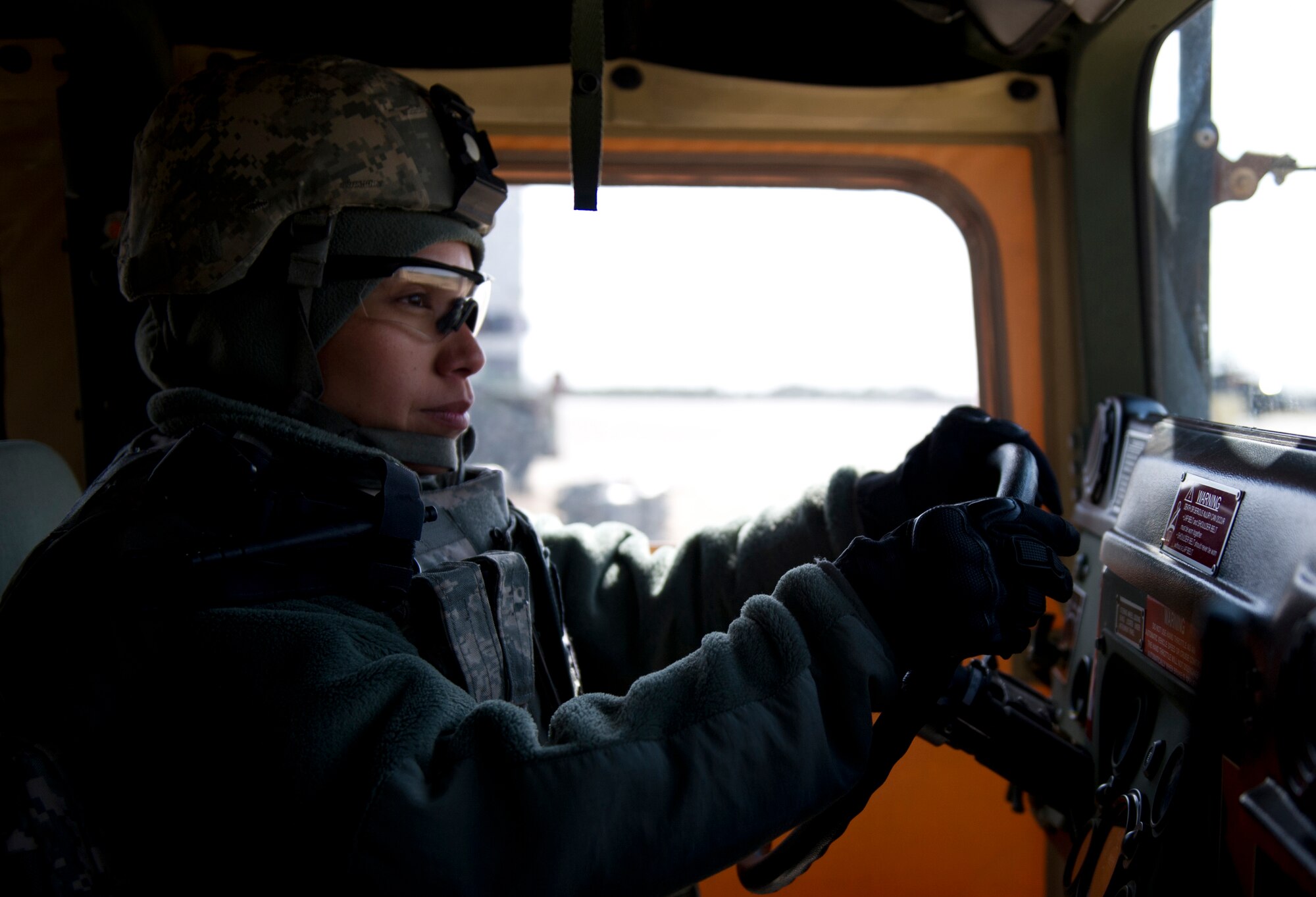 Major Maureen Trujillo, 571st Global Mobility Readiness Squadron assistant director of operations, drives a HMMWV during Eagle Flag 13-1 exercise at Joint Base McGuire-Dix-Lakehurst, N.J., March 14.  (U.S. Air Force photo by Staff Sgt. Gustavo Gonzalez)