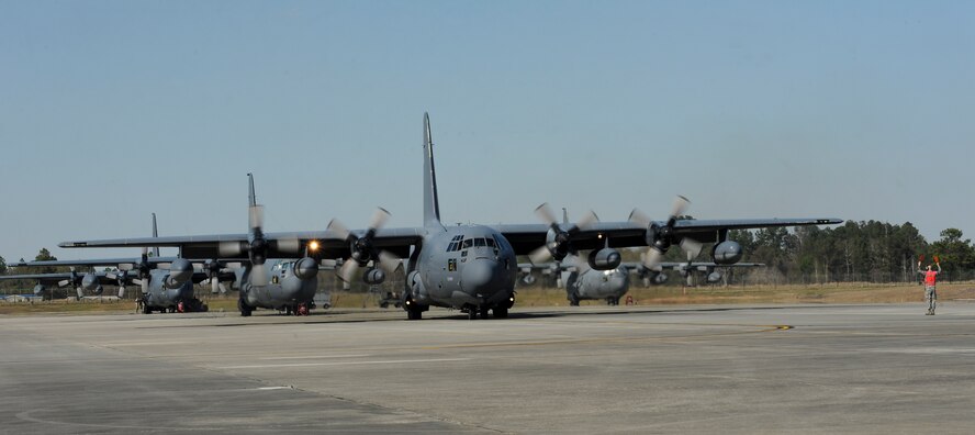 U.S. Air Force Staff Sgt. Ryan James, HC-130P flying crew chief, marshals in aircraft 65-0988 at Moody Air Force Base, Ga., March 16, 2013. This was the final flight for aircraft that is schedule to retire later this month. (U.S. Air Force photo by Airman Alexis Grotz/Released)