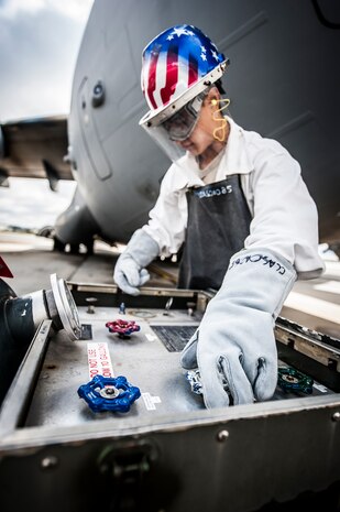 Airman 1st Class Nicholas McCracken, 437th Aircraft Maintenance Squadron crew chief, opens a valve on the liquid oxygen tank, releasing LOX into a metal hose that leads up to a C-17 Globemaster III March 19, 2013, at Joint Base Charleston – Air Base, S.C. Liquid oxygen is used as a means of distributing breathable air to aircrew members and passengers above 10,000 feet above sea level. The C-17 can hold approximately 155 gallons of LOX.  (U.S. Air Force photo/Senior Airman Dennis Sloan)