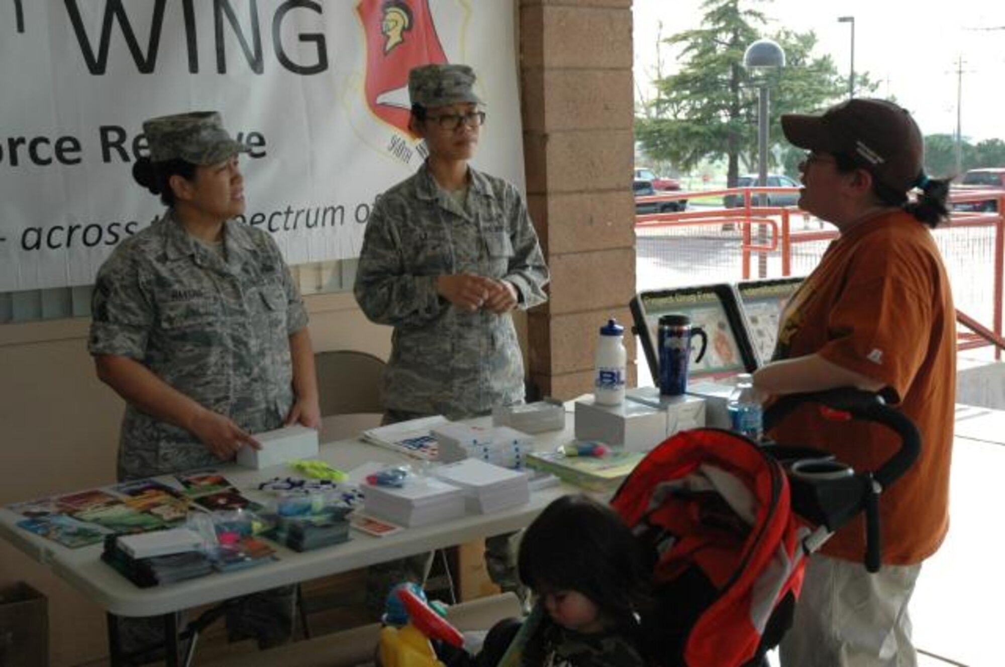 SMSgt Havens (left) explains the benefits of a drug free lifestyle during a health fair at her sons' school March 19. SMSgt Havens was asked to attend the fair to help educate parents and students about drug and alcohol abuse prevention. (U.S. Air Force Photo/Dana Lineback)