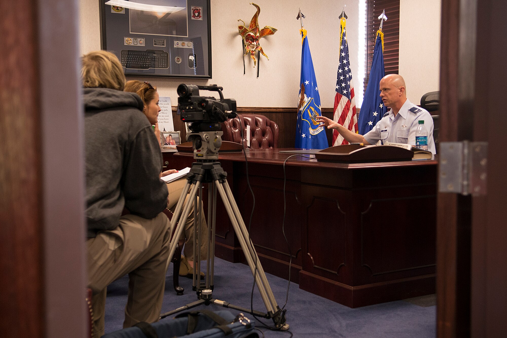 U.S. Air Force Col. Jonathan Ellis, 307th Bomb Wing commander, is interviewed by KTAL Channel 6 News reporters following the announcement of the wing's nuclear certification, Mar. 20, 2013, Barksdale Air Force Base, La. The wing achieved this historic milestone after passing its Initial Nuclear Surety Inspection, becoming the first Reserve unit in Air Force history to become nuclear certified. (U.S. Air Force photo by Master Sgt. Greg Steele/Released)