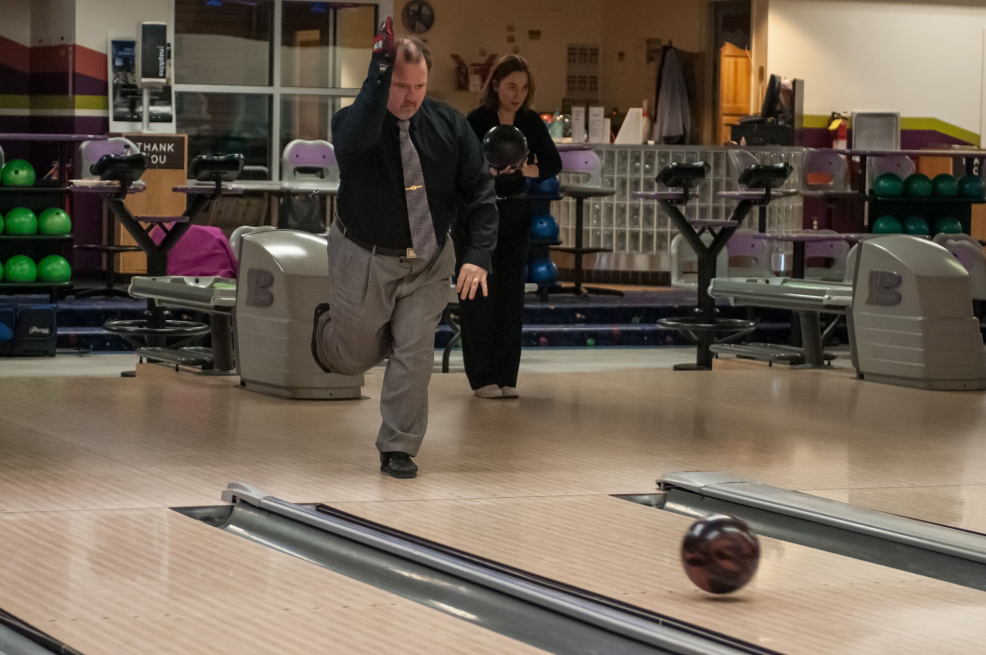 HANSCOM AIR FORCE BASE, Mass. – Damon Miller works on his bowling form while Janna Miller prepares for her shot during the Two for One Bowling Fun at Hanscom Lanes March 13. The special allows customers to bring a friend Tuesday through Friday from 11 a.m. to 4 p.m. and bowl for the price of one. (U.S. Air Force photo by Rick Berry)