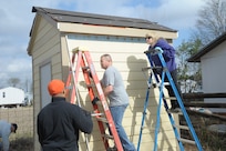 Air Force Master Sgt. Terrence Link, Master Sgt. Jose Silva and Chief Master Sgt. Sandy Pfeffer,
Joint Base San Antonio-Randolph, volunteer at a Habitat for Humanity of San Antonio construction
site March 14. (U.S. Air Force photo by Joel Martinez)