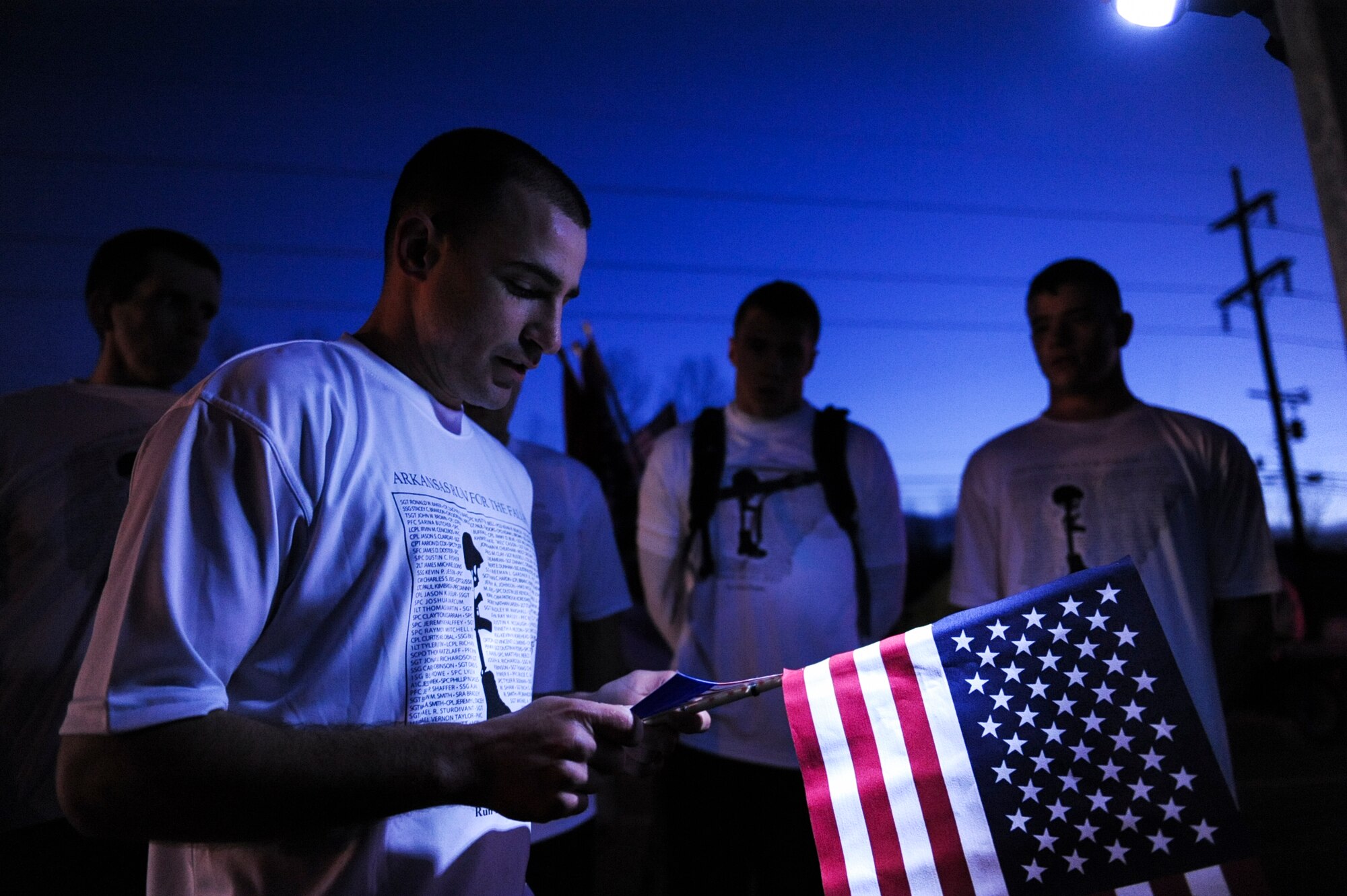 Sgt. Anthony Viehmeyer, master instructor at the Center for Naval Avionics Technical Training, reads the biography of a fallen Arkansan March 16, 2013, at Ozark, Ark. The Arkansas Run for the Fallen is a 138 mile run that commemorates an Arkansan that has been killed in action since 2001. (U.S. Air Force photo by Airman 1st Class Cliffton Dolezal)