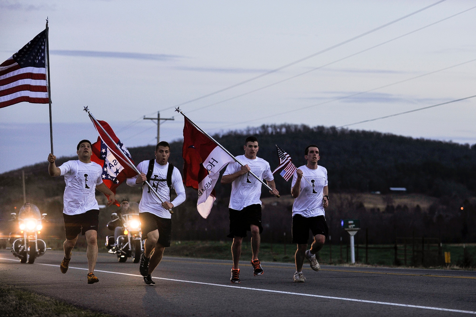 Runners take off as the second annual Arkansas Run for the Fallen commences March 16, 2013,  at Ozark, Ark. The Run for the Fallen is a 138 mile run that commemorates Arkansan’s that were killed in action since 2001 every mile. (U.S. Air Force photo by Airman 1st Class Cliffton Dolezal) 