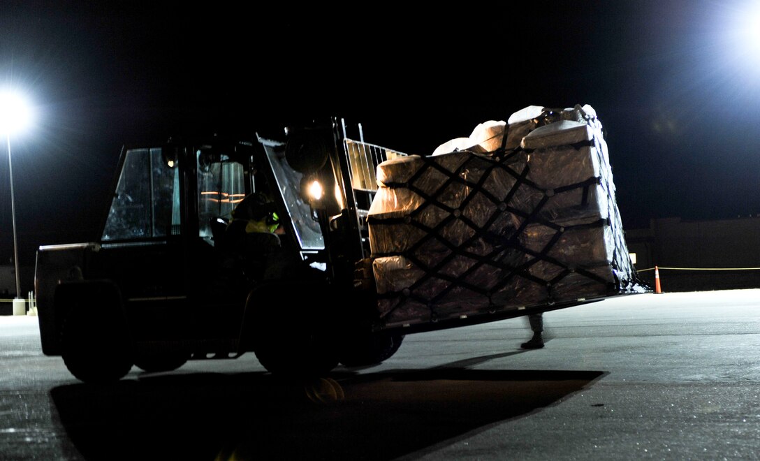 A cargo palette of equipment is transported to a designated area during an Operational Readiness Exercise at Ellsworth Air Force Base, S.D., March 19, 2013. The ORE tested the base’s ability to move equipment efficiently and safely in support of worldwide operations. (U.S. Air Force photo by Airman 1st Class Anania Tekurio/Released)  