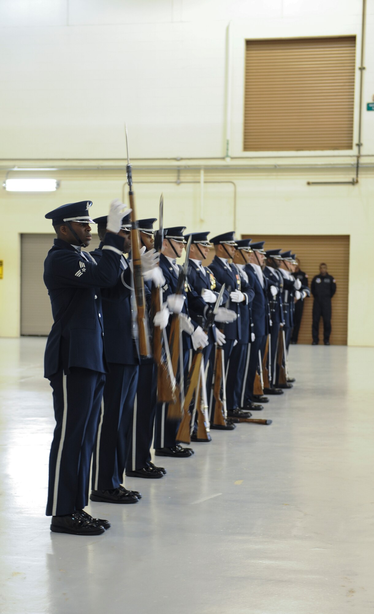 The U.S. Air Force Honor Guard Drill Team demonstrates the domino effect drill movement at Moody Air Force Base, Ga., March 14, 2013.  The drill team is known for their precision and  discipline.(U.S. Air Force photo by Airman Alexis Grotz/Released)