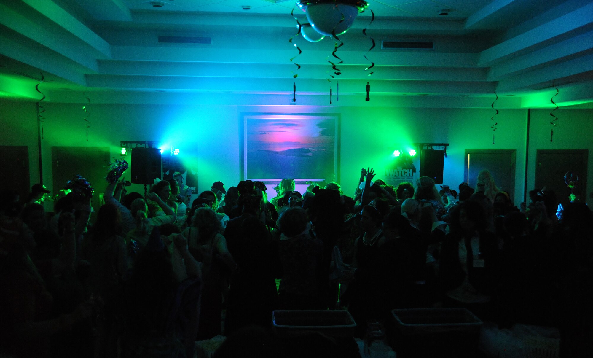 Key spouses from the 509th Bomb Wing dance during a party hosted by a live disc-jockey during Whiteman Air Force Base’s first annual Spouses’ Dining-In at Mission’s End March 16, 2013. The event was put together to help build a network of support among the wing’s key spouse members. (U.S. Air Force photo by Staff Sgt. Nick Wilson/Released) 