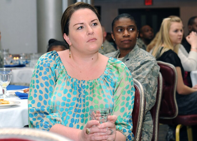 Erin Salvador, 39th Force Support Squadron, listens as Chaplain (Lt. Col) Scott Rummage, 39th Air Base Wing head chaplain, gives a speech during the Commander’s National Prayer Breakfast March 21, 2013, at Incirlik Air Base, Turkey. Chaplain Rummage was the guest speaker for the event, which is held annually to give members of Incirlik the opportunity to pray together about issues affecting military members and their families. (U.S. Air Force photo by Staff Sgt. Marissa Tucker/Released)