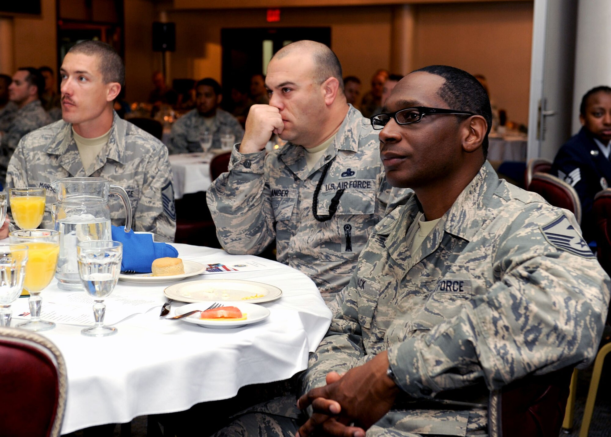Attendees of the Commander’s National Prayer Breakfast listen to presentations by Airmen, which were followed by a prayer, March 21, 2013 at Incirlik Air Base, Turkey. The event is held annually to give members of Incirlik the opportunity to pray together about issues affecting military members and their families. (U.S. Air Force photo by Staff Sgt. Marissa Tucker/Released)
