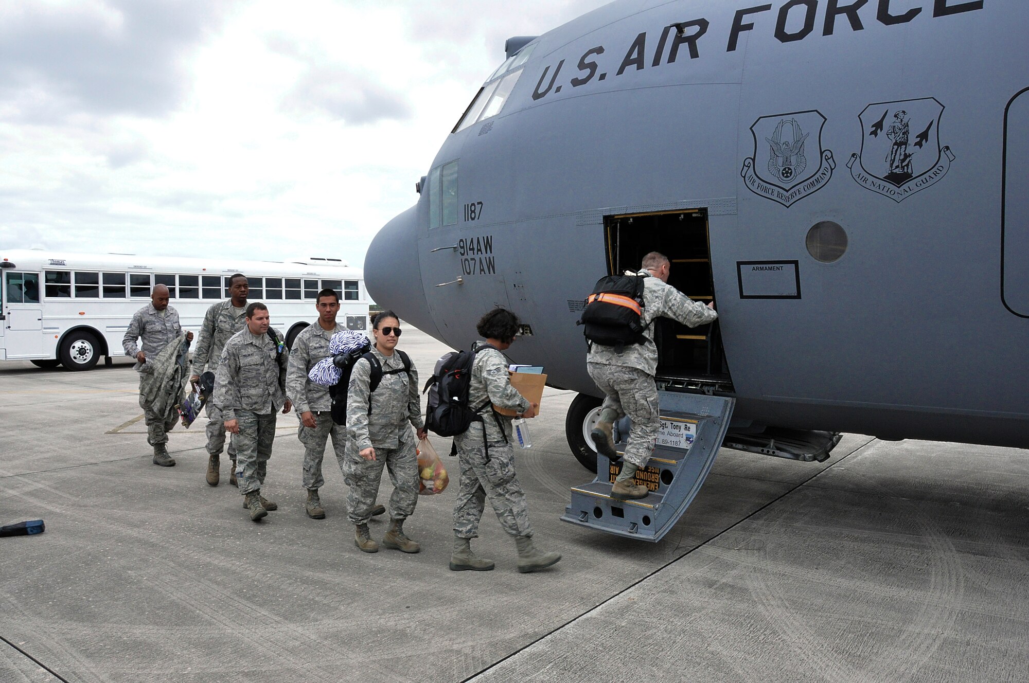Airmen from the 482nd Fighter Wing of Homestead Air Reserve Base, Fla., board a C-130 to travel from Homestead ARB to Eglin Air Force Base, Fla., in support of Combat Hammer, a weapons system evaluation program used to determine the validity of munitions products and processes, March 18 through 22. Over 160 Airmen and 12 F-16s are participating in the evaluation. (U.S. Air Force photo/Staff Sgt. Lou Burton)