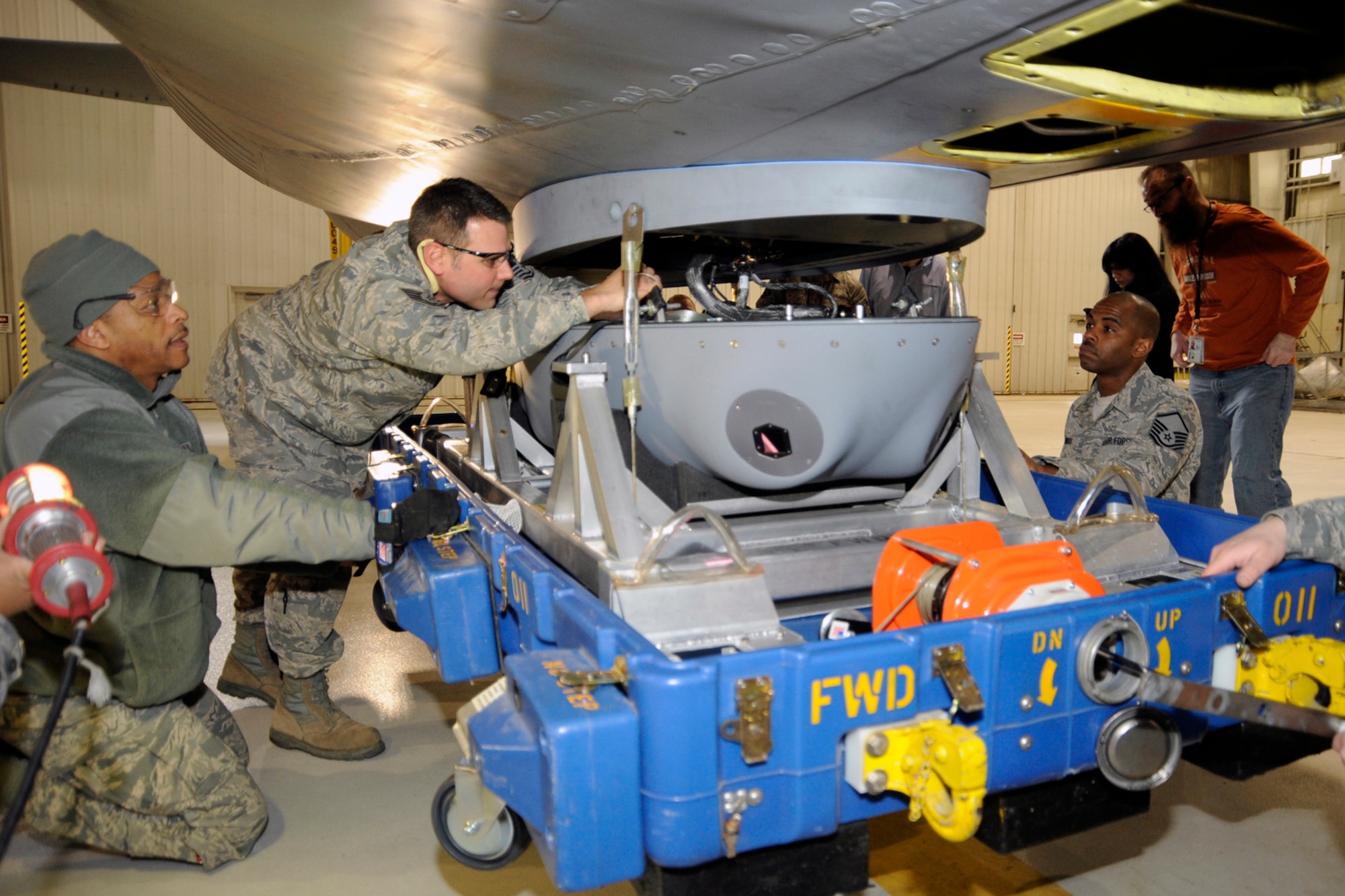 130312-Z-HC784-075 - Technical Sgt. John Kerschenheiter connects the final ground wires to marry a prototype LAIRCM -- large aircraft infrared countermeasure -- pod to a KC-135 Stratotanker prior to the final seating of the pod at Selfridge Air National Guard Base, Mich., March 12, 2013. Assisting Kerschenheiter are Technical Sgt. Louis Jones (left) and Master Sgt. David Bowers (right). All three Airmen are members of the 191st Maintenance Squadron at Selfridge. (Air National Guard photo by John S. Swanson)