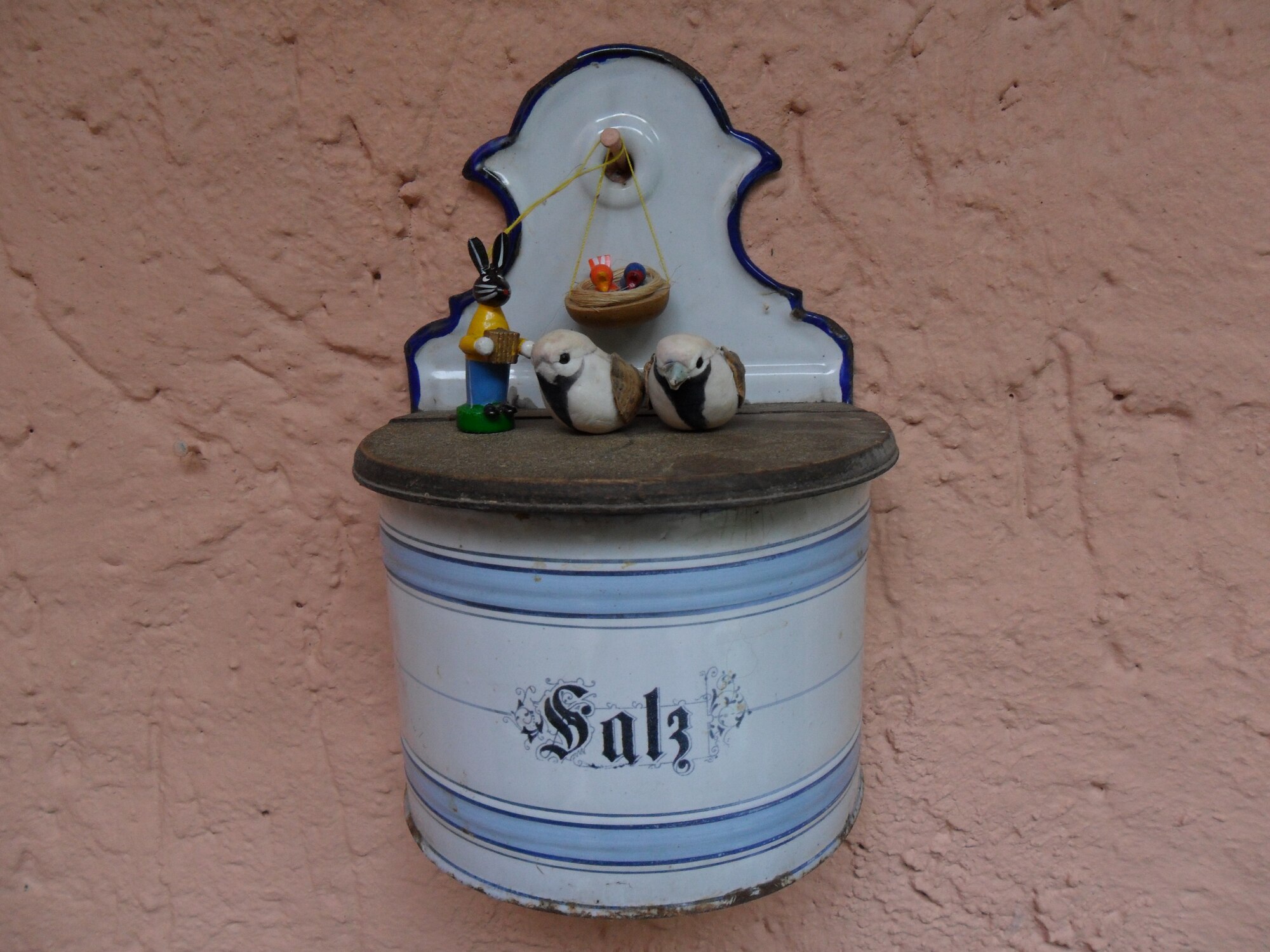SPANGDAHLEM AIR BASE, Germany -- For Easter, German people typically decorate their houses and front yards with various Easter decorations, to include painted eggs or other ornaments, and often wooden rabbits. A resident of Landscheid set up this piece of decoration on her house wall. The ideas and decorations by people vary. (U.S. Air Force photo by Iris Reiff/Released)