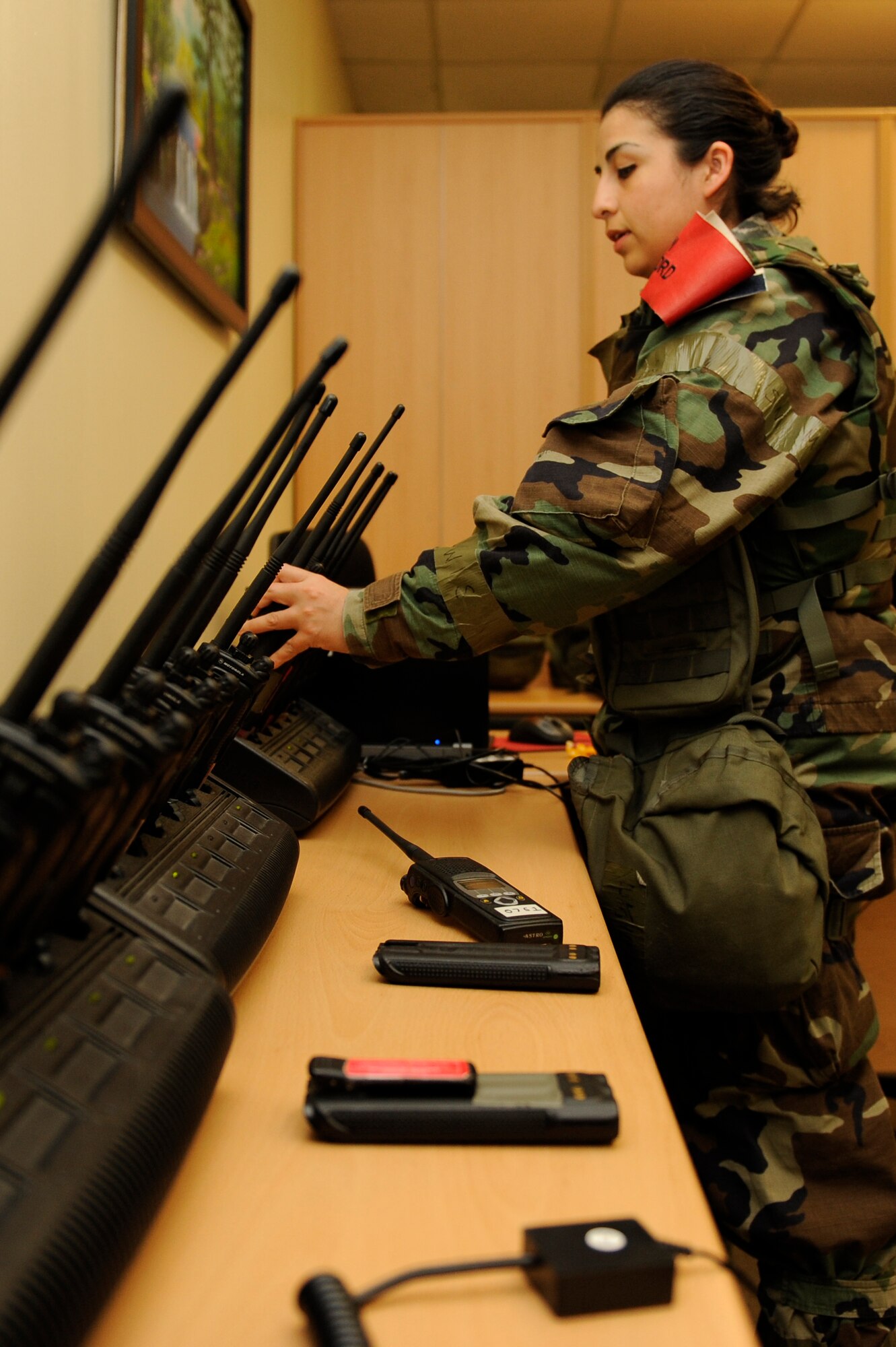 KUNSAN AIR BASE, Republic of Korea -- 1st Lt. Angelica Silva Garza, 8th Fighter Wing plans and programs, charges land-mobile radios during exercise Beverly Midnight 13-2 at Kunsan Air Base, Republic of Korea, March 21, 2013. Airmen in Bearcat Control were responsible for establishing 24-hour communications between the exercise director, Exercise Evaluation Team members, moulage, role player cells, and ensured an uninterrupted flow for the overall sequence of events designed to test the Wolf Pack’s ability to respond to various scenarios. (U.S. Air Force photo by Senior Airman Marcus Morris/Released)