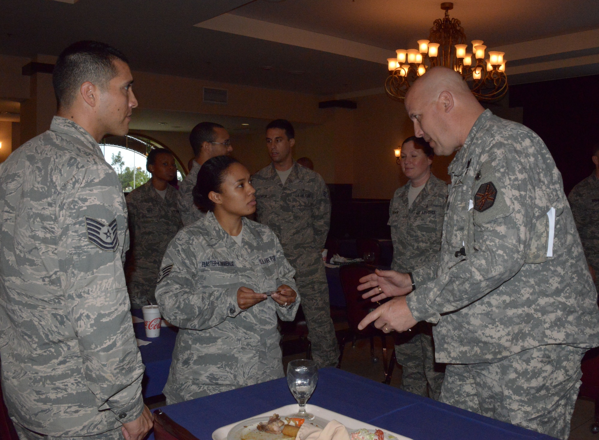 U.S. Army Command Sgt. Maj. Kevin Nolan, U.S. Army Garrison Torii Station, speaks with U.S. Air Force Airmen during a Kadena G-6 Leadership Summit on Kadena Air Base, Japan, March 11, 2013. Nolan attended the summit to bring a joint perspective to the group and learn about each of Kadena's six enlisted professional organizations. (U.S. Air Force photo/Tech. Sgt. Kristine Dreyer)