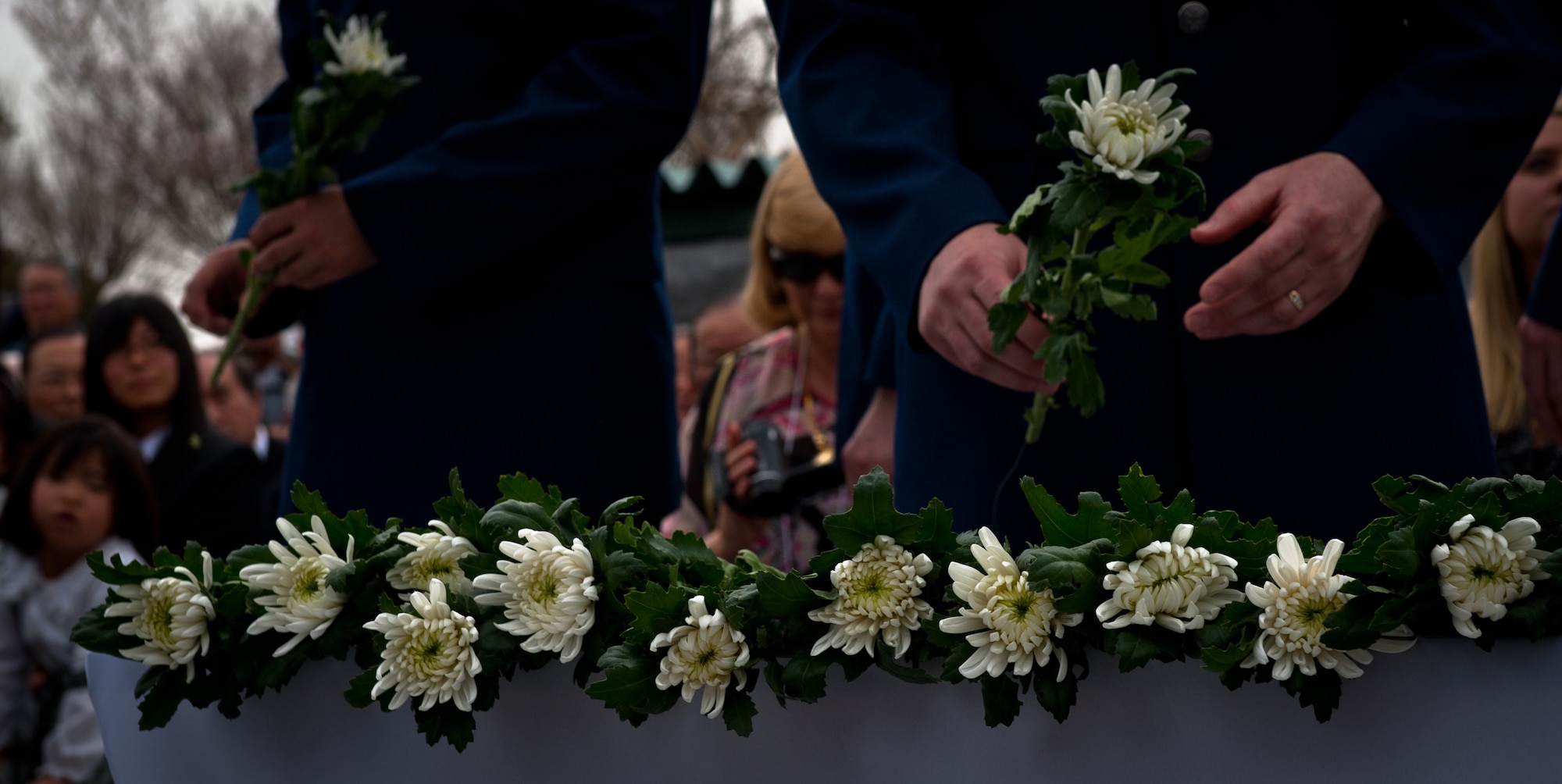GUNMA PREFECTURE, Japan -- Airmen from Yokota Air Base, Japan, lay flowers during a ceremony March 20, 2013, at Gunma Prefecture, Japan. Each flower honored a life lost during the B-29 crashes in Gunma during World War II. (U.S. Air Force photo by Senior Airman Cody H. Ramirez)
