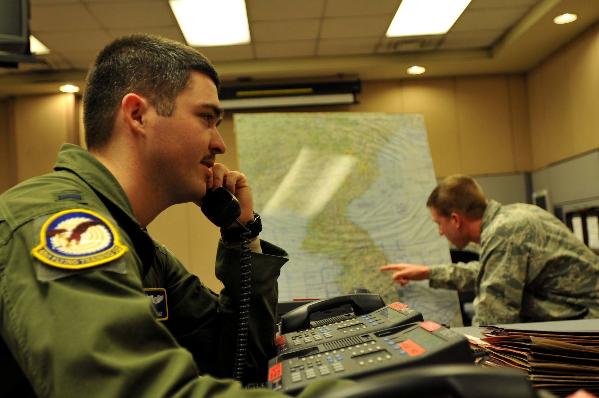 U.S. Air Force 1st Lt. Ken Bidmead, 7th Air Force White Cell aircrew operations operator, responds to a simulated scenario during Exercise Key Resolve at Osan Air Base, Republic of Korea, March 21, 2013. Key Resolve is an annual combined and joint command post exercise that is executed under various scenarios with the purpose of honing the skills necessary to defend the Republic of Korea by improving ROK-U.S. combined forces’ operational capabilities, coordinating and executing the deployment of U.S. reinforcements and maintaining ROK military combat capabilities. (U.S. Air Force photo/Airman 1st Class Hailey R. Davis)