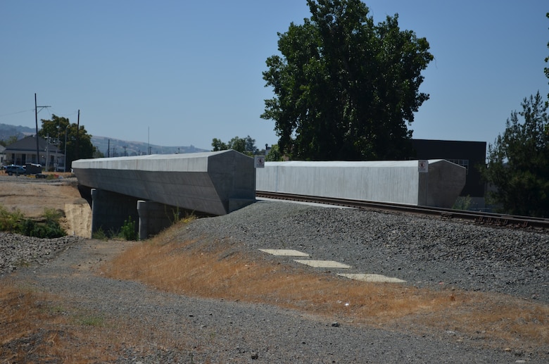 A new railroad bridge spans across the Napa River in Napa, Calif., on July 10, 2012. The U.S. Army Corps of Engineers constructed the new bridge, replacing an older bridge that was five feet lower in elevation and collected large debris that created a dam in the river. The bridge was constructed as part of a $65 million American Recovery and Reinvestment Act of 2009 contract raised more than 3,300 feet of railroad track and replaced two bridges. The Napa River Flood Control Project is a joint effort of the Corps, city of Napa and the Napa Flood Control and Water Conservation District.  