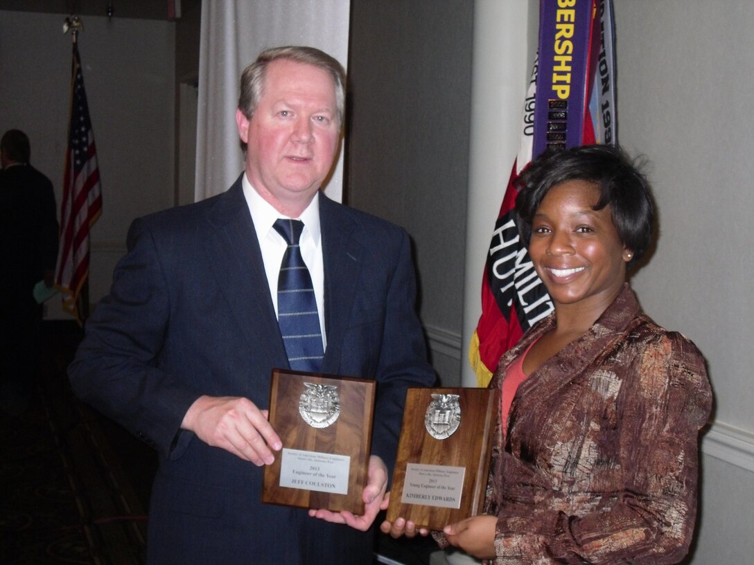Huntsville Center's Jeff Coulston and Kim Edwards show off their awards after the Society of American Military Engineers Huntsville Post ceremony Feb. 21.