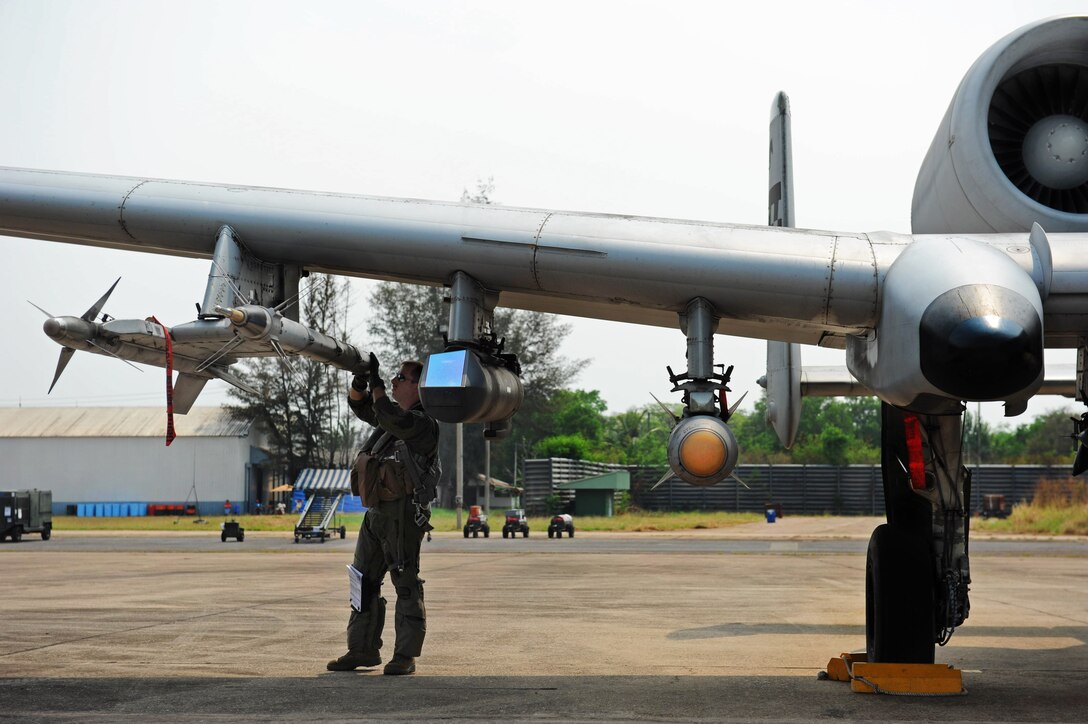 A U.S. Air Force A-10 Thunderbolt II pilot prepares for a mission during Cope Tiger 13 at Udon Thani Thai air force base, Thailand, March 15, 2013. The pilot is assigned to the 25th Fighter Squadron.