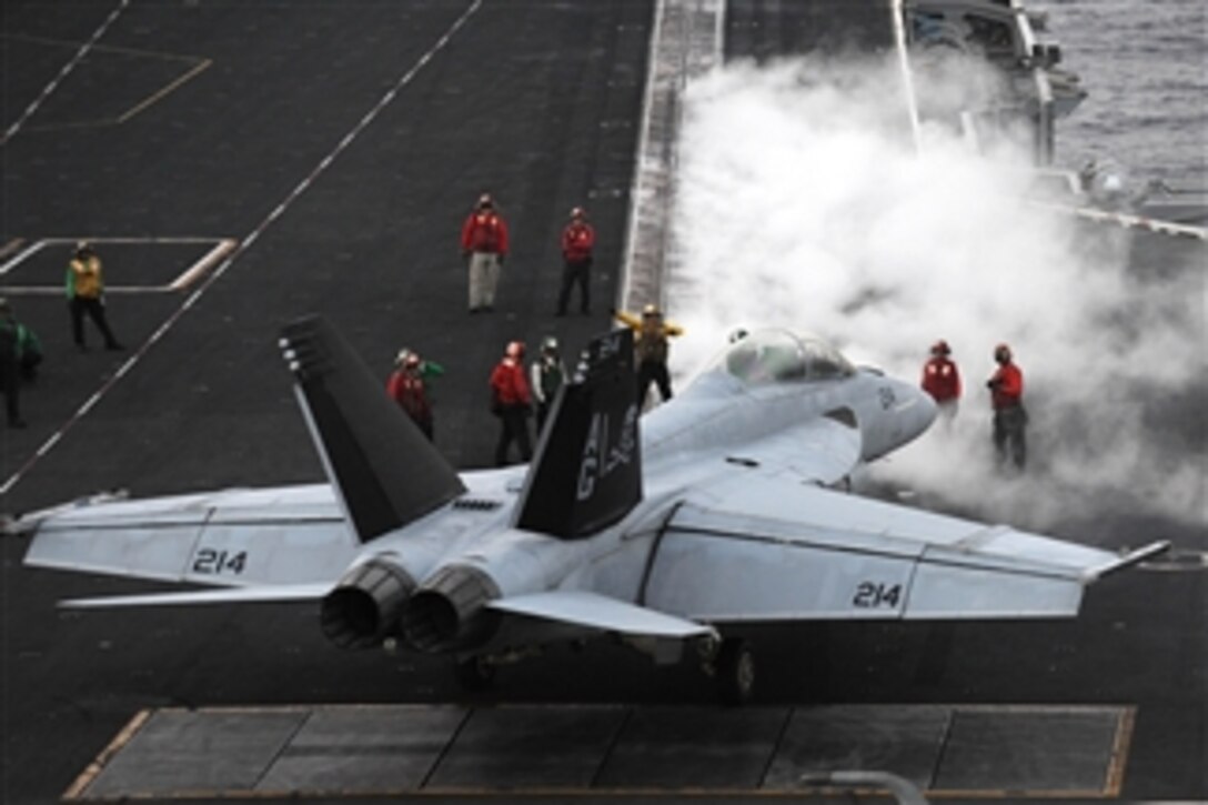 A U.S. Navy F/A-18F Super Hornet is directed to a steam catapult aboard the aircraft carrier USS Dwight D. Eisenhower (CVN 69) as the ship conducts flight operations in the Red Sea on March 18, 2013.  The Eisenhower is deployed to the 5th Fleet area of responsibility to conduct maritime security operations and theater security cooperation efforts.  The Super Hornet is attached to Strike Fighter Squadron 103.  