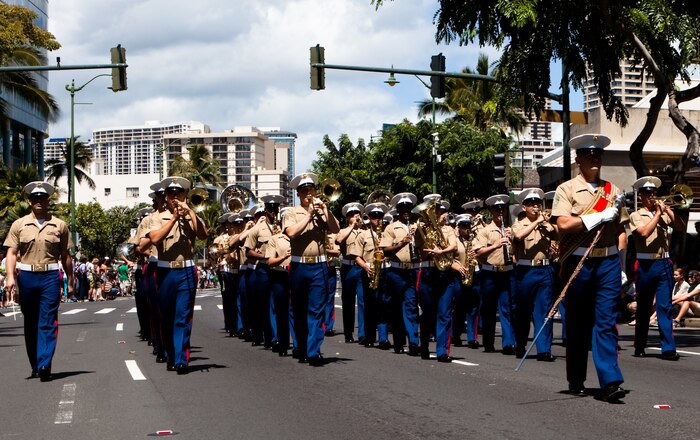 HONOLULU — Marines of the U.S. Marine Corps Forces, Pacific Band play the “Marines’ Hymn” while marching during the 45th annual St. Patrick’s Day parade in Waikiki, March 17. Thousands of tourists, local residents and spectators crowded the street to see the parade’s entertainment for the afternoon. While not a legal holiday in the U.S., St. Patrick’s Day is popularly celebrated across the country and other parts of the world. (U.S. Marine Corps photo by Cpl. James A. Sauter)
