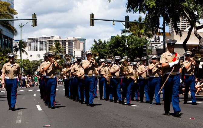 HONOLULU — Marines of the U.S. Marine Corps Forces, Pacific Band play the “Marines’ Hymn” while marching during the 45th annual St. Patrick’s Day parade in Waikiki, March 17. Thousands of tourists, local residents and spectators crowded the street to see the parade’s entertainment for the afternoon. While not a legal holiday in the U.S., St. Patrick’s Day is popularly celebrated across the country and other parts of the world. (U.S. Marine Corps photo by Cpl. James A. Sauter)