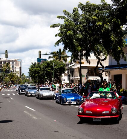 HONOLULU — Vintage muscle cars roll down the Waikiki shopping strip during the 45th annual St. Patrick’s Day parade, March 17. Thousands of tourists, local residents and spectators crowded the street to see the parade’s entertainment for the afternoon. While not a legal holiday in the U.S., St. Patrick’s Day is popularly celebrated across the country and other parts of the world. (U.S. Marine Corps photo by Cpl. James A. Sauter) 