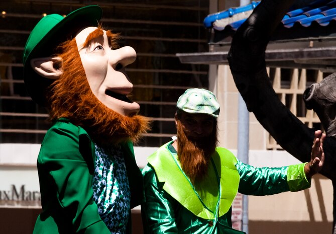 HONOLULU — A performer dressed in a leprechaun costume greets attendees during the 45th annual St. Patrick’s Day parade, March 17. Thousands of tourists, local residents and spectators crowded the street to see the parade’s entertainment for the afternoon. While not a legal holiday in the U.S., St. Patrick’s Day is popularly celebrated across the country and other parts of the world. (U.S. Marine Corps photo by Cpl. James A. Sauter) 

