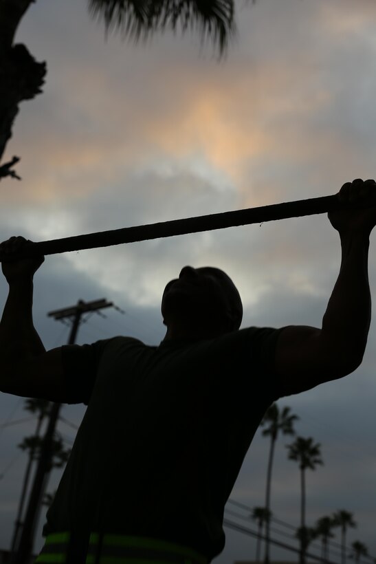 MARINE CORPS BASE CAMP PENDLETON- A Marine with the 11th Marine Expeditionary Unit  does pull-ups as part of a physical fitness test here March 22. 