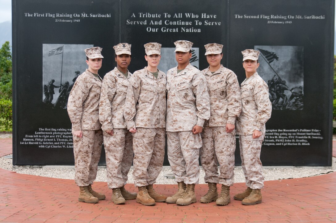 MARINE CORPS BASE HAWAII - From left: Cpl. Andrea Johnson, reports clerk with the military finance office; Petty Officer 2nd Class Althea Matteson, a Navy corpsman with Combat Logistics Battalion 3; Cpl. Alecia Walker, travel clerk, the military finance office; Sgt. Jasmine Matos, administrative separations support noncommissioned officer in charge, Legal Services Center; Lance Cpl. Martha Artiga, Staff Judge Advocate clerk, Legal Services Center; and Lt. Col. Heidi McKenna Schmitt, Marine Corps Base Hawaii base inspector. They participated in an Iwo Jima flag re-enactment photo in honor of Women's History Month. (U.S. Marine Corps photo by Kristen Wong)