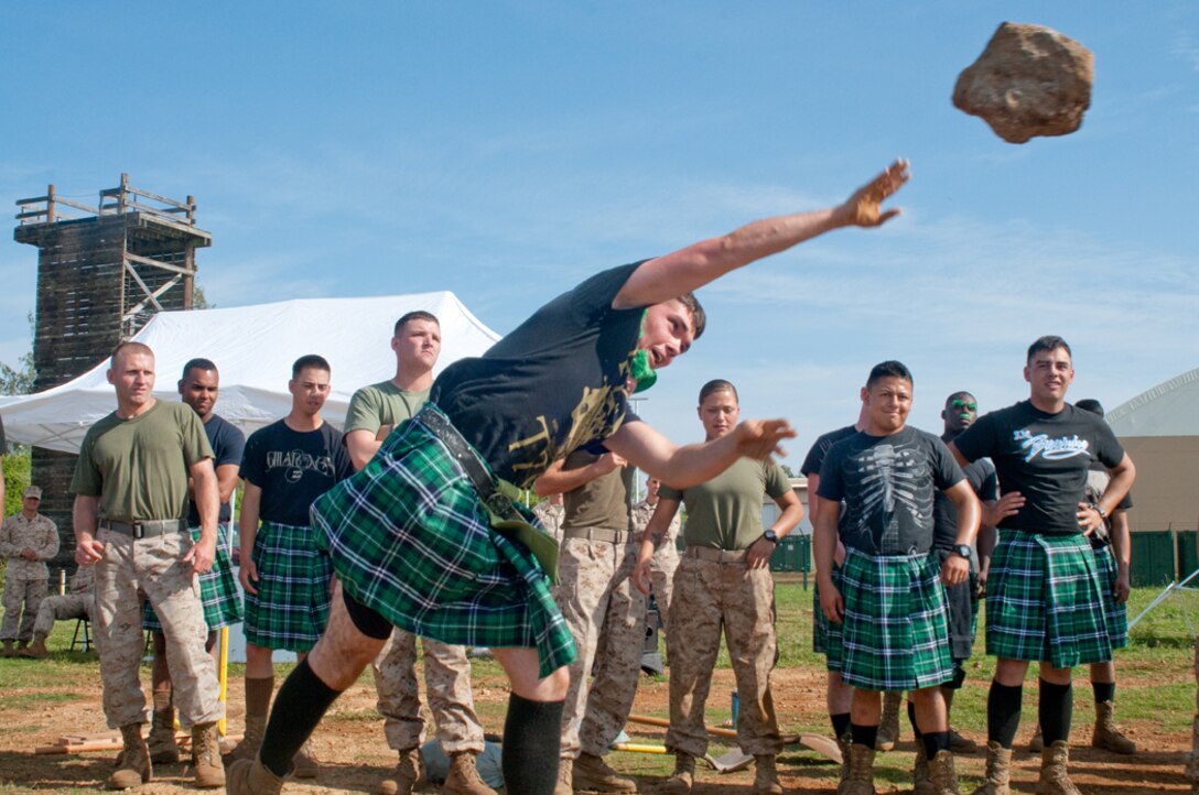 MARINE CORPS BASE HAWAII - Lance Cpl. Harley Matthews, a combat engineer with Combat Logistics Battalion 3 hurls a rock during the open stone put challenge, March 15, 2013. The combat engineers participated in several Highland events as well as traditional games using combat engineer’s equipment. (U.S. Marine Corps photo by Christine Cabalo)