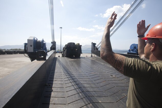 U.S. Marines from 3D Marine Expeditionary Brigade, III Marine Expeditionary Force, offloaded an amphibious assault vehicle from the USNS 1st Lt. Jack Lummus, March 21, during annual exercise Freedom Banner 2013 Maritime Prepositioning Force offload in Subic Bay, Republic of the Philippines. More than 270 Marine Corps tactical vehicles and amphibious assault vehicles were offloaded in support of FB13 and Balikatan 2013, an annual bilateral exercise that takes place in the Philippines. The MPF program supports global positioning of Marine Air-Ground Task Force and naval equipment and supplies in response to a range of military operations from the quick and rapid buildup of combat power to humanitarian assistance and disaster relief.
