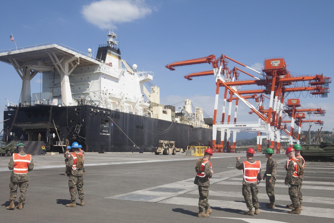 U.S. Marines, 3D Marine Expeditionary Brigade, during Freedom Banner 13 (FB13) unload vehicles from the U.S. Naval Ship 1st Lt. Jack Lummus, in Subic Bay, Republic of the Philippines, March 21, 2013. The purpose of the exercise is to help in the response time and working together effectively to provide relief and assistance in the event of natural disasters and other crises that threaten public safety and health. 
