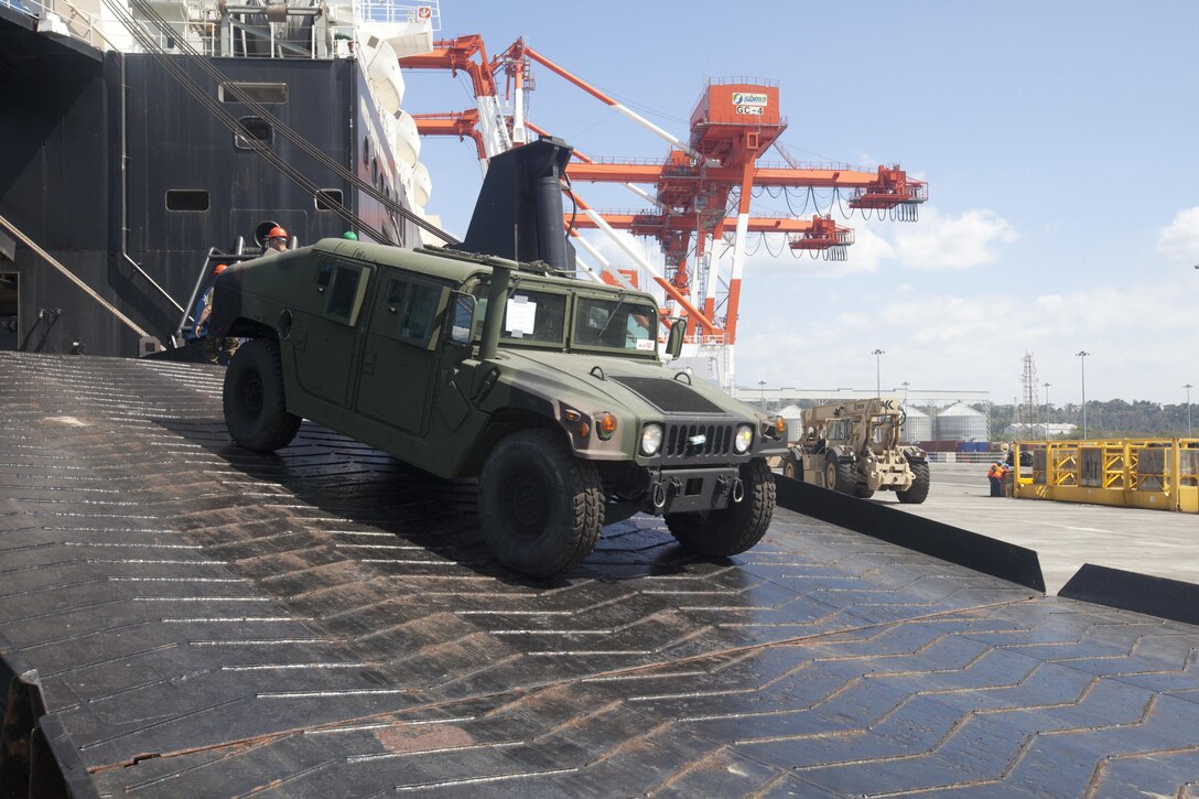 U.S. Marines from 3D Marine Expeditionary Brigade, III Marine Expeditionary Force, offloaded a High Mobility Multipurpose Wheeled Vehicle pier-side from the USNS 1st Lt. Jack Lummus, March 21, during annual exercise Freedom Banner 2013 Maritime Prepositioning Force offload in Subic Bay, Republic of the Philippines. More than 270 Marine Corps tactical vehicles and amphibious assault vehicles were offloaded in support of FB13 and Balikatan 2013, an annual bilateral exercise that takes place in the Philippines. The MPF program supports global positioning of Marine Air-Ground Task Force and naval equipment and supplies in response to a range of military operations from the quick and rapid buildup of combat power to humanitarian assistance and disaster relief.