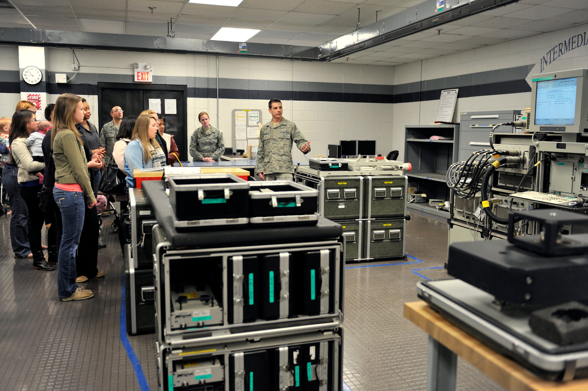U.S. Air Force Staff Sgt. David Dunnett, 20th Component Maintenance Squadron avionics team lead, talks to spouses from the 20th CMS about the different equipment used by the avionics flight, Shaw Air Force Base, S.C., March 22, 2013. Spouses from 20th CMS were invited to tour the different shops in the squadron to gain a better understanding of the role their husbands have in the mission of the wing. (U.S. Air Force photo by Senior Airman Amber E. N. Jacobs/Released)











