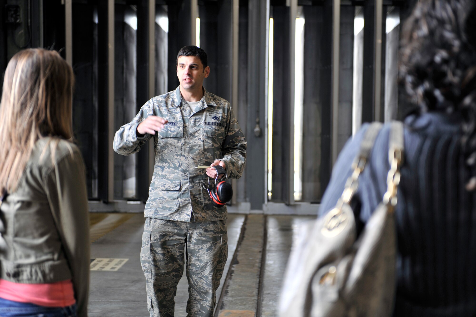 U.S. Air Force Master Sgt. Terrence Packey, 20th Component Maintenance Squadron test cell section chief, explains to spouses how the walls of the hush house are specially made to prevent sound from escaping the building, Shaw Air Force Base, S.C., March 22, 2013. The 20th CMS hosted the spouse’s tour for family members to see what their loved ones do on a daily basis. (U.S. Air Force photo by Senior Airman Amber E. N. Jacobs/Released)



