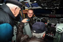 Capt. Dana Stockton shows retired Lt. Col. Francis Leslie gadgets and controls inside the cockpit of a KC-135 Stratotanker at Fairchild Air Force Base, Wash., March 1, 2013. The KC-135 has a global positioning system, a capability that does the same job Leslie performed as a navigator when he served. Stockton is the 92nd Operations Support Squadron weapons and tactics commander. (U.S. Air Force photo by Senior Airman Earlandez Young)  