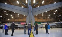 The Leslie family looks around the outer body of a KC-135 Stratotanker March 1, 2013, inside hangar 2050 at Fairchild Air Force Base, Wash. The Leslies visited Fairchild to celebrate Francis Leslie’s 90th birthday. Francis is a former B-52D Stratofortress radar operator who served nine years at Fairchild from 1956 until 1965. (U.S. Air Force photo by Senior Airman Earlandez Young)  