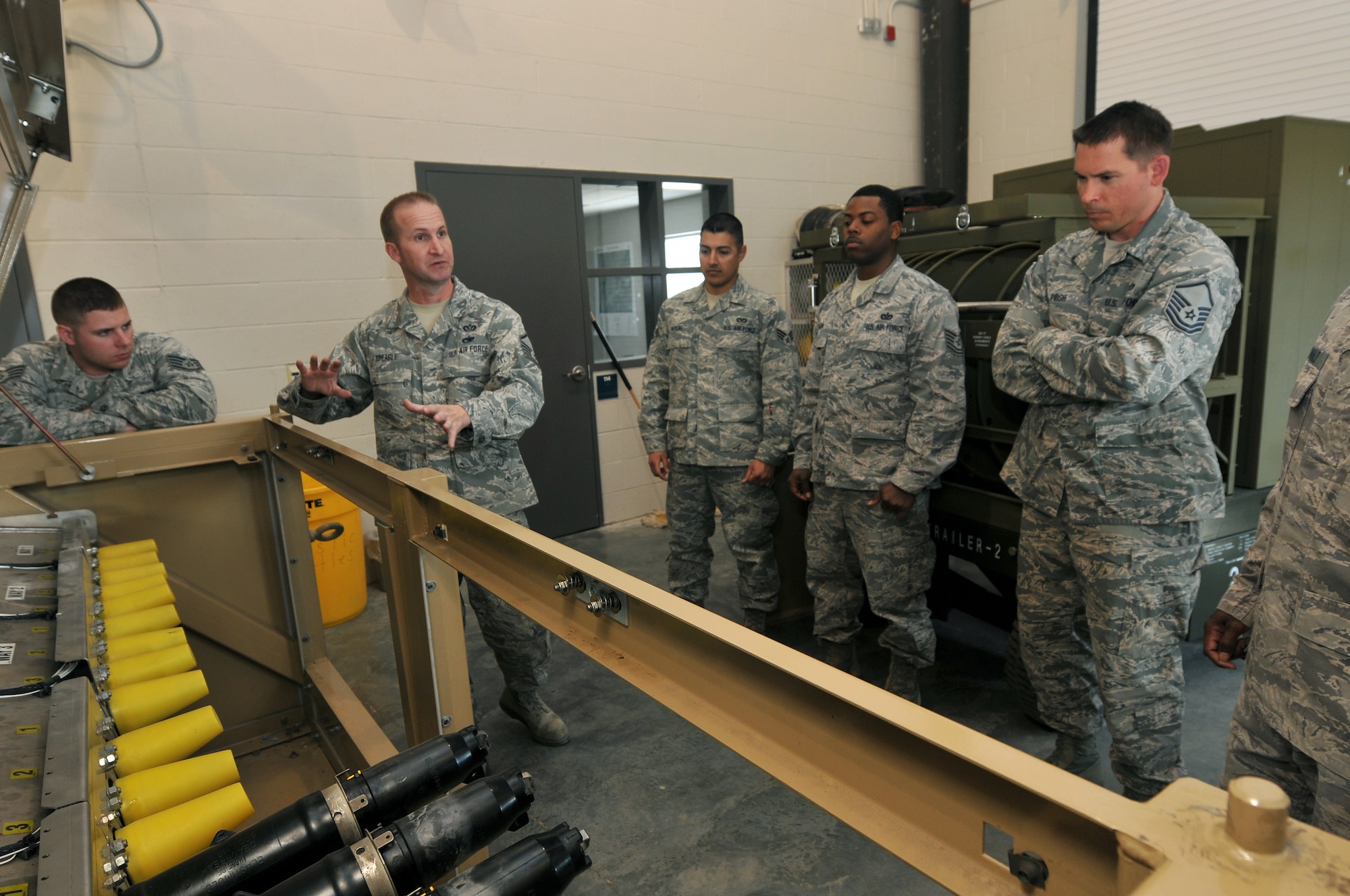 NEW LONDON, N.C. -- During a Mission Essential Equipment Training class held in March 2013, Master Sgt. Christopher R. Speagle, Prime BEEF Manager, 145th Civil Engineering Squadron demonstrates operations on a piece of equipment called a Primary Switching Center. The class taught at the 145th North Carolina Air National Guard Regional Training Site in New London, N. C., was a mixture of Active and Guard personnel. Member's home stations included Charleston and Whiteman Air Force Base and the Oklahoma Air National Guard. (National Guard photo by Tech. Sgt. Patricia Findley, 145th Public Affairs)


