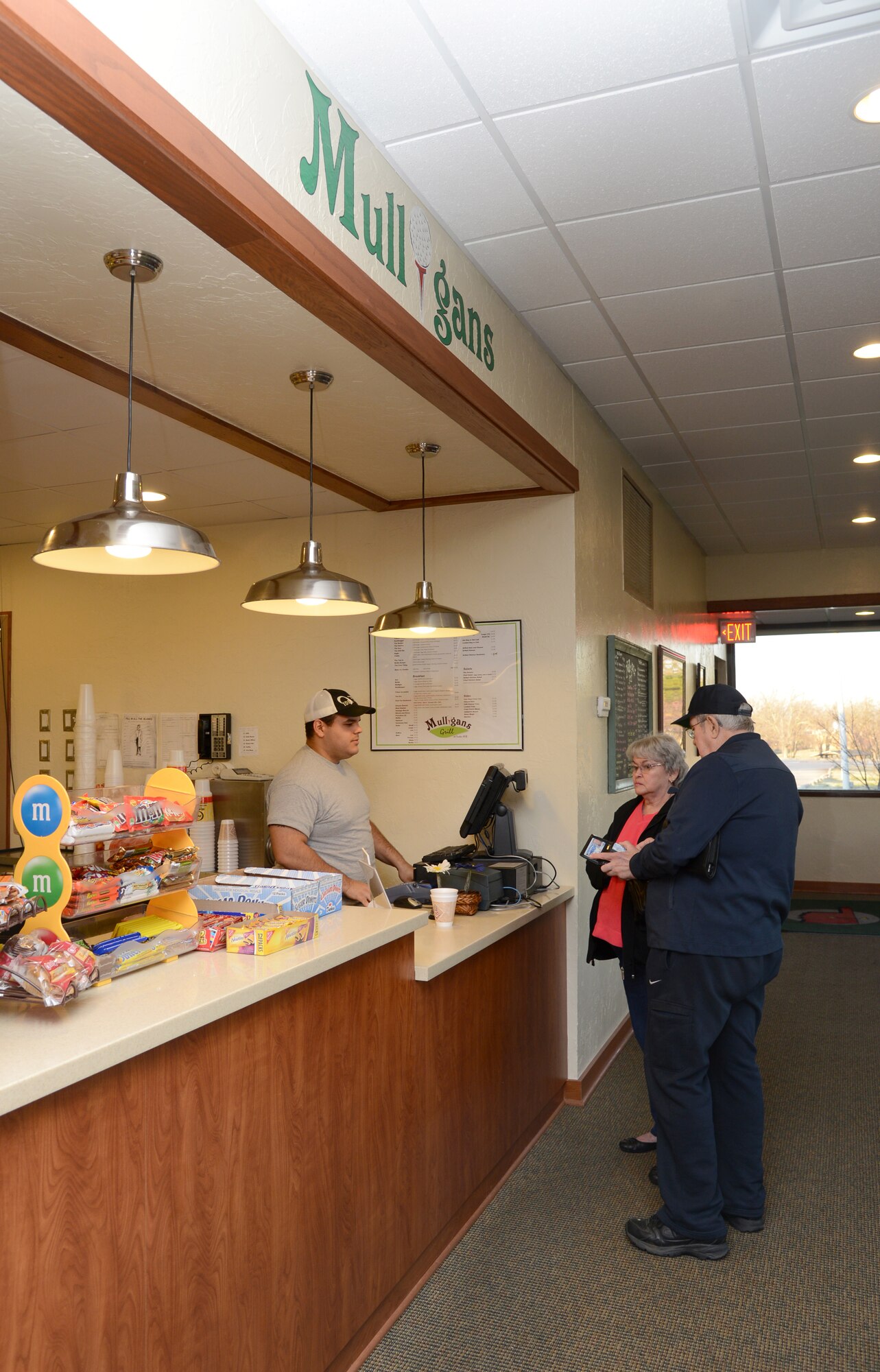 Yoan Pagan takes customer’s breakfast orders at Mulligan’s Grill at the Tinker Golf Course. Mr. Pagan works as a cook in the recently remodeled restaurant, which anyone on base is welcome to eat at. (Air Force photo by Kelly White)