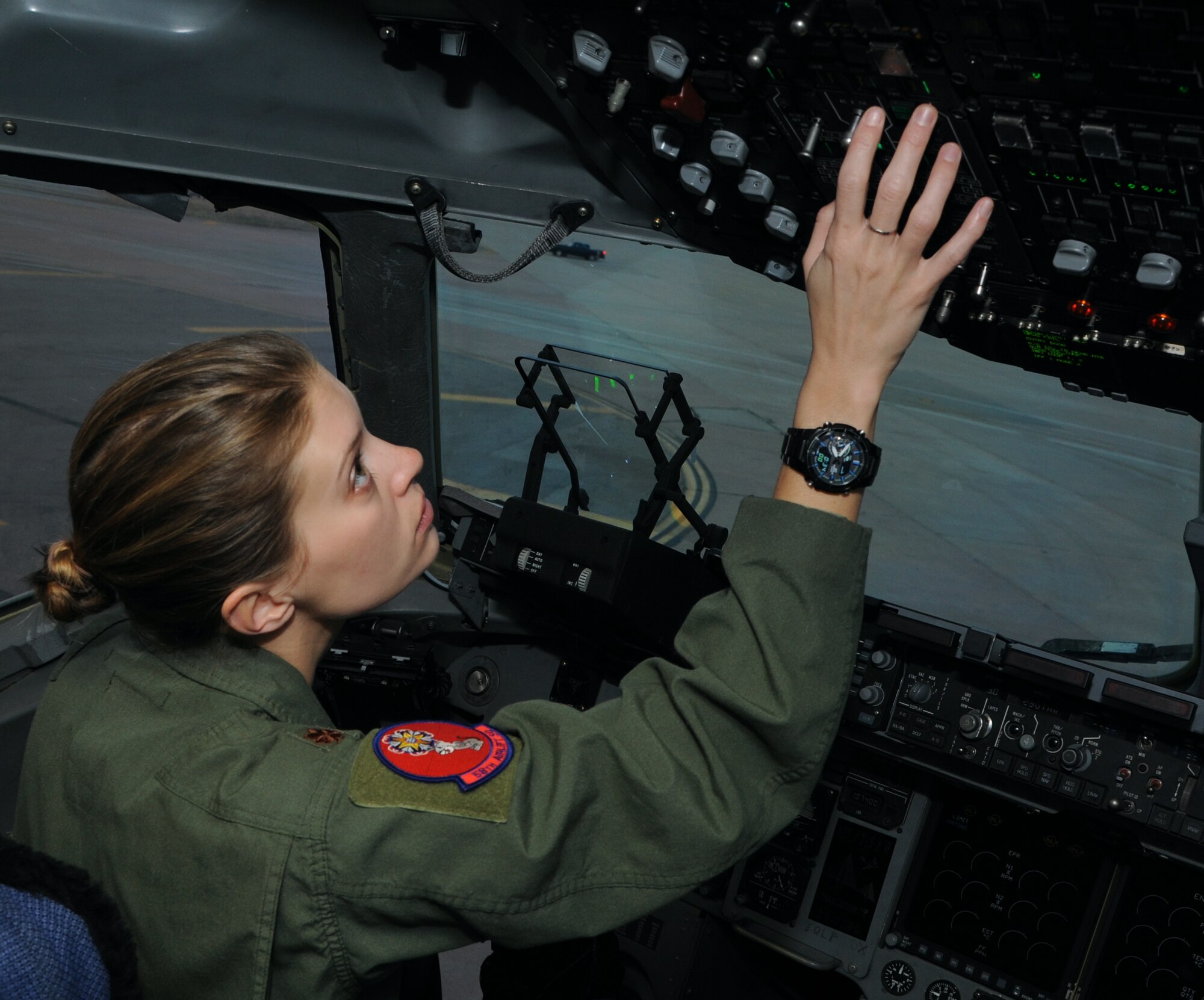 ALTUS AIR FORCE BASE, Okla. – Maj. Meghan Fridley, 58th Airlift Squadron C-17 Globemaster III evaluator pilot, conducts a pre-flight inspection in the cockpit of a C-17, March 19, 2013. Fridley shared her journey to becoming a female Air Force pilot, including her trials, inspiration and successes. (U.S. Air Force photo by Airman 1st Class Klynne Pearl Serrano / Released)