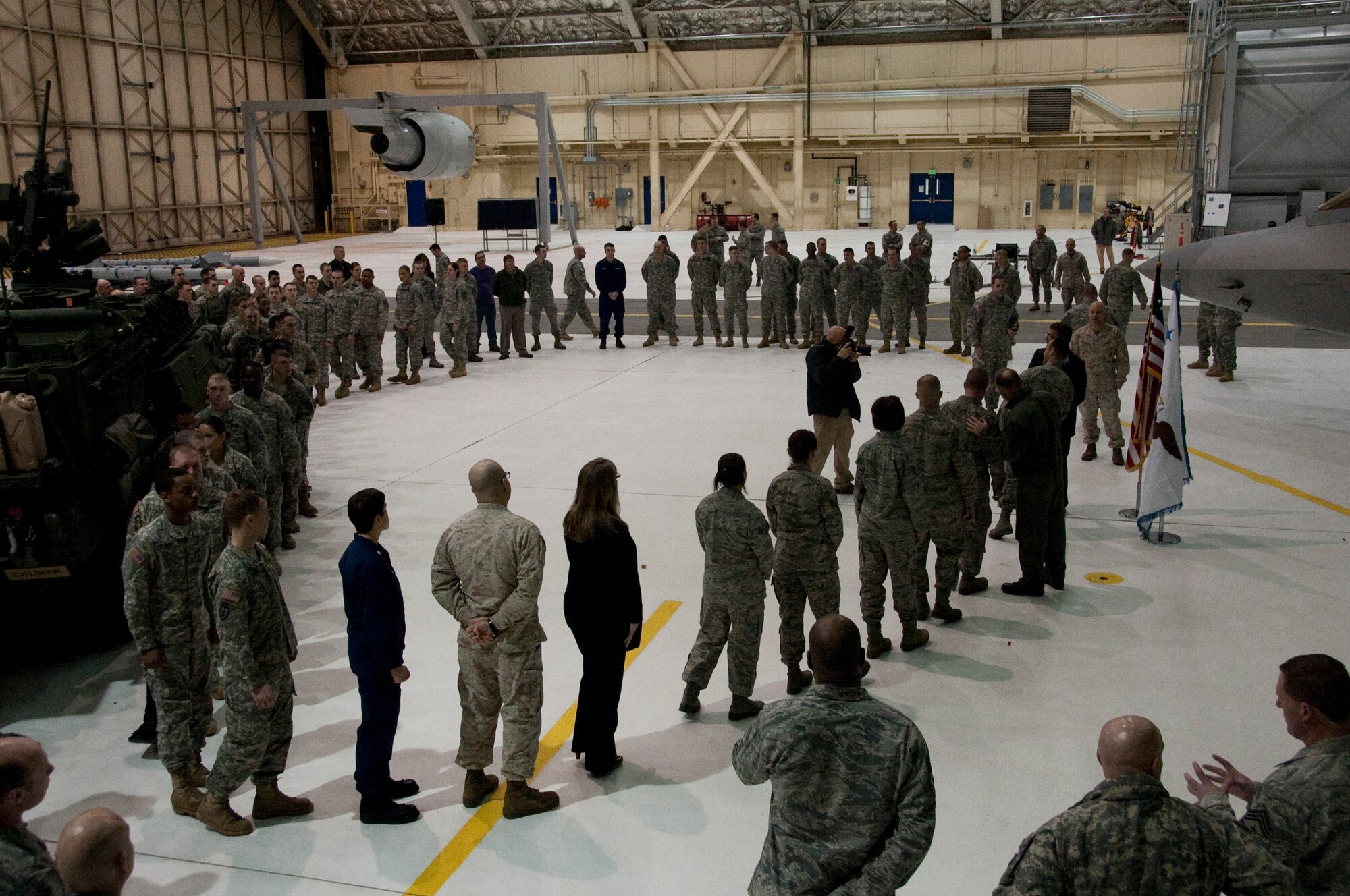 More than 150 Soldiers, Marines, Airmen and Cost Guardsmen wait in line to be coined by U.S. Deputy Defense Secretary Dr. Ashton Carter on Joint Base Elmendorf-Richardson, March 21. Carter used his visit to JBER to give thanks and praise to all JBER service members. 