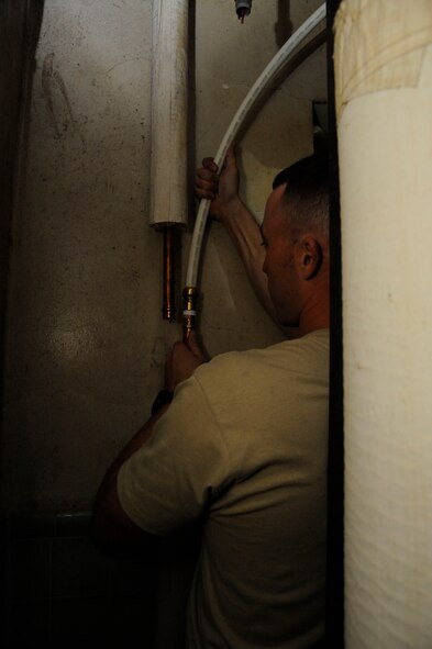 Staff Sgt. William Stell, 2nd Civil Engineer Squadron Water and Fuel Systems Maintenance, installs a new water line on Barksdale Air Force Base, La., March 22. The 2 CES Water and Fuel Systems Maintenance section helps maintain Barksdale's infrastructure by repairing and installing piping and maintaining the fuel pump system used to fuel the B-52H Stratofortress. (U.S. Air Force photo/Airman 1st Class Andrew Moua)
