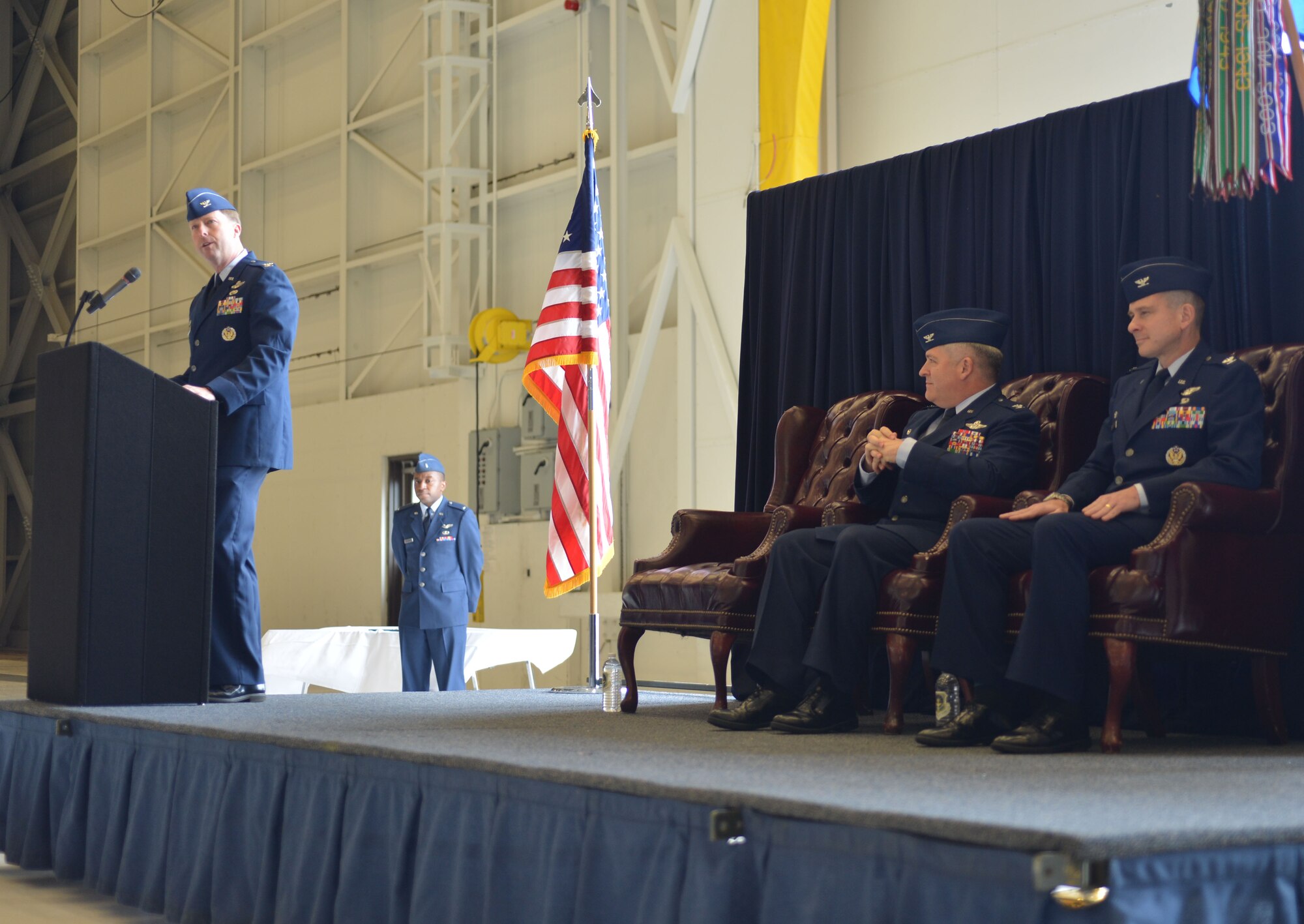 Col. Wyn Elder, 62nd Airlift Wing commander, introduces Col. Andrew Hird, incoming 62nd Operations Group commander during the 62nd OG Change of Command ceremony March. 21, 2013, at Joint Base Lewis-McChord, Wash. Hird took command from Col. Paul Eberhart. Hird previously served as the Operations Support Division chief for the Joint Distribution Process Analysis Center in support of the U.S. Transportation Command. (U.S. Air Force photo/Airman 1st Class Jacob Jimenez)
