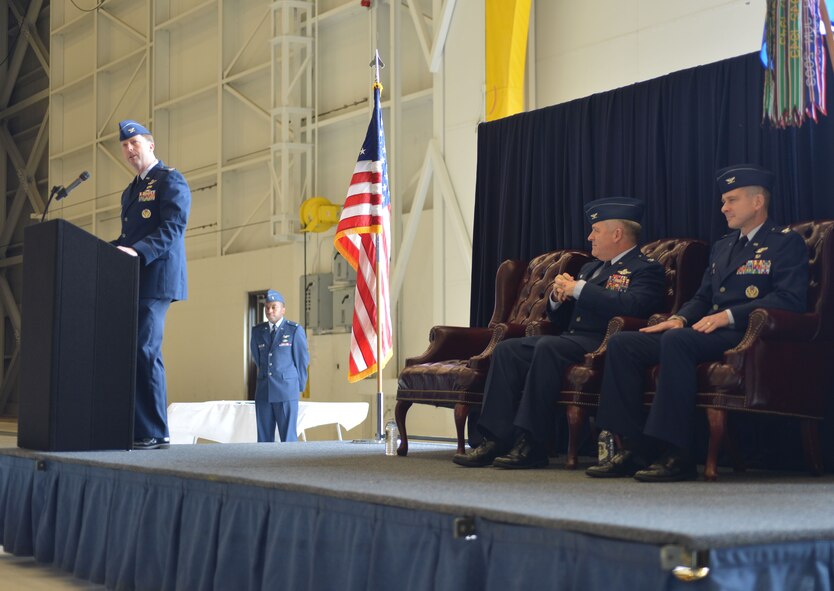 Col. Wyn Elder, 62nd Airlift Wing commander, introduces Col. Andrew Hird, incoming 62nd Operations Group commander during the 62nd OG Change of Command ceremony March. 21, 2013, at Joint Base Lewis-McChord, Wash. Hird took command from Col. Paul Eberhart. Hird previously served as the Operations Support Division chief for the Joint Distribution Process Analysis Center in support of the U.S. Transportation Command. (U.S. Air Force photo/Airman 1st Class Jacob Jimenez)