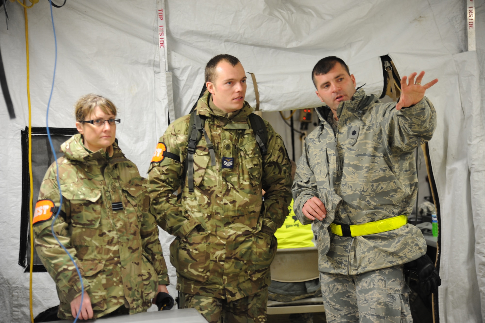 JOINT BASE MCGUIRE-DIX-LAKEHURST, N.J. – Lt. Col. Patrick Clark, 60th Aerospace Medicine Squadron, gives members of the Brazilian Air Force a tour of the Joint Task Force-Port Opening during EAGLE FLAG 13-1 here, March 12. Approximately 120 Airmen, and 50 Soldiers Lakehurst participated in the EAGLE FLAG exercise. The Joint Task Force-Port Opening was tested on their ability to quickly establish operations, provide their own security, track cargo and personnel and move supplies from the planes to customers quickly and efficiently. (U.S. Air Force photo by Capt. Brooke Brzozowske)