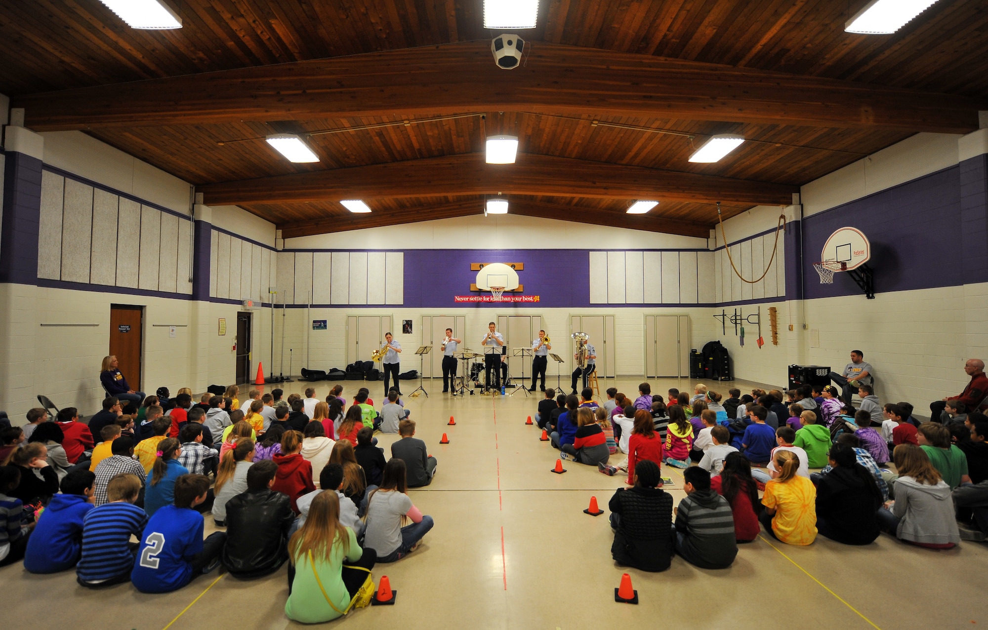 The Heartland of America Band’s Offutt Brass ensemble performs at the LeMay Elementary School’s gymnasium on March 21, Offutt Air Force Base, Neb.  The brass ensemble played classical music from composer’s representing several countries around the world.  (U.S. Air Force photo by Josh Plueger/Released)